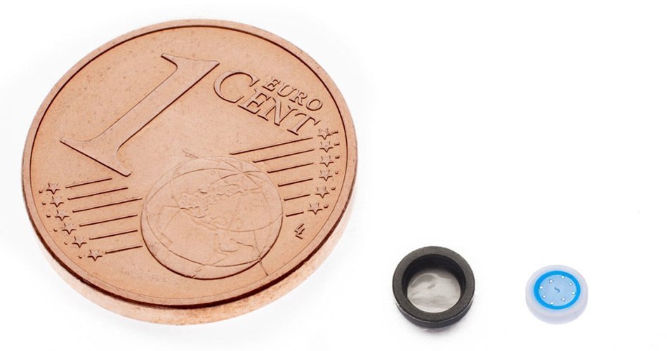 Comparison of our LSR micromolding parts and a penny.